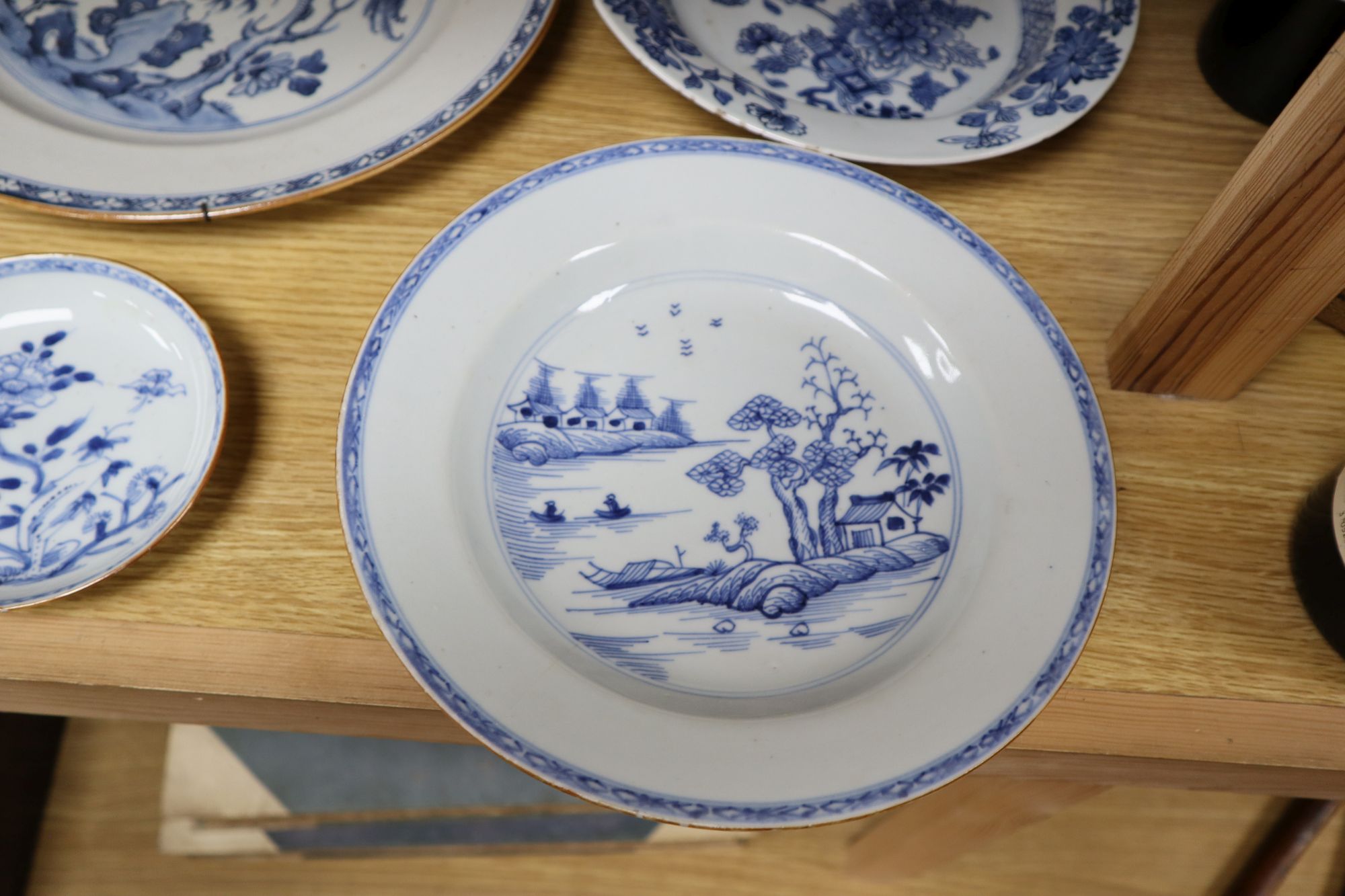 A collection of mostly 18th century Chinese export plates and dishes, a Chinese famille rose dish and another similar smaller dish